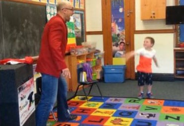 Child Laughing During Magic Show Finale